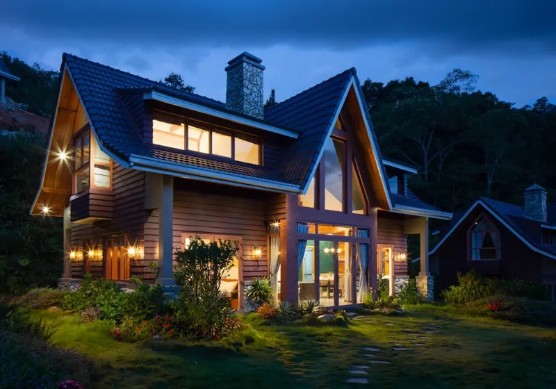A house at dusk with its lights on